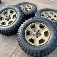 17 jeep Wrangler Rubicon OEM 
Bronze wheels and tires

Asking $ 900